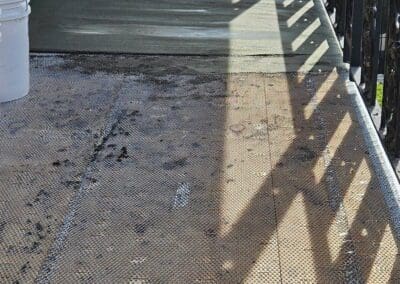 a walkway with a metal railing